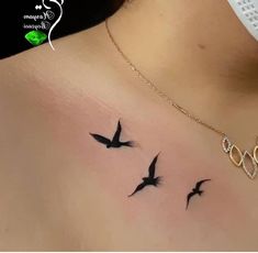 a woman's chest with three birds on it and the word boo written in cursive font