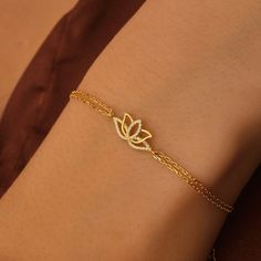 Solid Gold Lotus Flower Bracelet, Dainty Lotus Charm Bracelet For Gift, Flower Bracelet  For Mom, Lotus Flower Bracelet For Christmas Gift This bracelet is handmade and produced with 10k 14k 18k solid gold according to your preference. Material : 10kt 14kt 18kt Solid Gold Gold Color : Yellow Gold, White Gold, Rose Gold Gemstone : Cubic Zirconia Pendant Size: Height : 0.28 inches ( 7 mm ) Width : 0.59 inches ( 15 mm ) We have 3 Types solid gold chain options: Type1 Chain (0.85mm thick) Type2 Chai Elegant Beaded Bracelets With Flower Charm As Gift, Flower Shaped Crystal Bracelet Gift, Spiritual Flower-shaped Bracelets For Gift, Spiritual Flower Bracelets For Gifts, Spiritual Flower-shaped Bracelets As Gifts, Elegant Crystal Bracelet With Flower Charm, Dainty Flower-shaped Crystal Bracelet, Elegant Gold Beaded Bracelet With Flower Charm, Dainty Flower Crystal Bracelet Gift