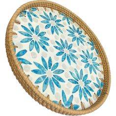 a basket with blue flowers painted on it