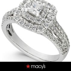 a diamond engagement ring with two rows of diamonds on it