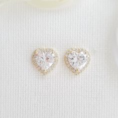 14K Gold Plated Cubic Zirconia Heart Stud Earrings for Weddings & Events These pretty 14k gold cubic zirconia heart earrings studs are sparkly for weddings and events. These pretty heart earrings are great for bridesmaids, brides, and any women looking for simple and heart-shaped sparkling earrings. These are made with high-grade cubic zirconia; you can use them for long periods, on every occasion after the wedding. The CZ heart-shaped gold earrings are available in two other finishes gold, silv Rose Gold Bridesmaid Jewelry, Gold Bridesmaid Jewelry, Minimalistic Earrings, Poetry Design, Rose Gold Heart Necklace, Gold Heart Stud Earrings, Heart Jewelry Set, Wedding Earrings Studs, Hearts Earrings