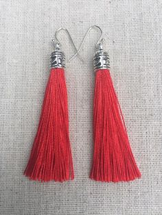 Chic red tassel earrings!  They would add a pop of color to any outfit for any occasion.  Dress them up or down.  They are timeless and versatile.  They are lightweight, fun and unique!The tassels measure 2 1/8” long by 1/4” wide.  They hang from simple silver ear wire hooks.  Overall drop length is about 2 1/4”.  Metal is allergy free plated silver.These are my latest creation!  I have them available in many colors!  Find them all under the category tassel earrings in my shop.Thanks for stoppin Red Tassel Drop Earrings For Pierced Ears, Red Tassel Drop Earrings Gift, Elegant Red Tassel Earrings As Gift, Elegant Red Tassel Drop Earrings, Elegant Red Tassel Earrings For Gift, Red Dangle Tassel Earrings With Latkans, Red Dangle Tassel Earrings As Gift, Red Dangle Tassel Earrings For Gift, Red Tassel Earrings For Gift