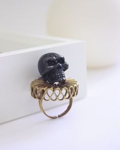 ** Another ring in our beautiful fantasy lord creatures ** The ring features lord skull finished in black, so it become rough feeling contrast to shinny golden tone of brass for collar.  We also have silver plated / gold plated and 925 sterling silver options available, so this part will be silver plated / gold plated and 925 sterling silver instead of brass respectively. Absolutely unique edition.                                  ------ Measurements & Objects Info ------              ** Weight :18 g. ** Ring Dimensions : approx. 2.5x2 cm. ** Ring size is available in options. And The ring has a gap so it is slightly adjustable itself too. ** Material : brass / enamel /  silver plated / gold plated / 925 Sterling Silver                                            -------- Shipping Note ---- Punk Rock Jewelry, G Ring, Key Bracelet, Buy Jewellery Online, Golden Ring, Casting Jewelry, Enamel Ring, Silver Enamel, Ring Jewelry