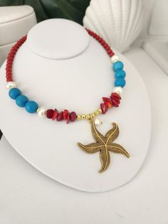 Turquoise and Red Big Starfish Necklace Add a touch of tropical elegance to your outfit with our turquoise and red Big Starfish necklace! This handmade necklace, made with love in Puerto Rico, is a unique piece that captures the essence of the Caribbean and its vibrant beauty.  Main pendant in the shape of a large starfish in Tibetan Brass. Genuine turquoise beads, red magnesites, red coral chips, glass pearls. Hand selected beads to ensure exceptional color and shine. Gold plated stainless stee Beach Turquoise Necklace With Starfish Charm, Turquoise Necklace With Starfish Charm For Beach, Turquoise Necklaces With Starfish Charm For Beach, Turquoise Jewelry With Colorful Beads For Beach Season, Bohemian Jewelry With Starfish Charm For Festivals, Beaded Turquoise Necklace With Round Beads For The Beach, Bohemian Necklaces For Beach Season Gifts, Ocean-inspired Turquoise Beaded Necklace For Vacation, Bohemian Necklaces As Gifts For Beach Season