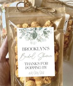 a person holding up a bag of popcorn with the words brooklyn's bridal sugar thanks for popping by on it