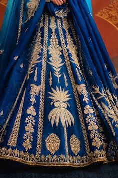 Navy blue lehenga featuring zardozi, cutdana embroidery in sehar and sitara motif. Paired with an embroidered, back tie-up detailed blouse, two dupattas and separate cancan skirt. - Aza Fashions Blue Semi-stitched Sharara With Motifs, Royal Blue Lehenga With Intricate Embroidery, Blue Semi-stitched Motif Sharara, Royal Blue Lehenga With Cutdana In Traditional Drape, Traditional Royal Blue Lehenga With Intricate Embroidery, Royal Blue Choli For Wedding And Navratri, Blue Gown With Intricate Embroidery For Festivals, Royal Blue Sharara With Pallu For Reception, Royal Blue Lehenga With Intricate Embroidery For Festivals