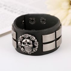 Do you love the gothic outfit? you should read our blog on the topic. this gothic leather skull is designed for dark outfits and dark minds! get yours without waiting! Greetings ladies and gentlemen, are you looking for a simple, sober, stealthy new bracelet to add to your collection, if so then this gothic skull bracelet will be ideal for you, with its great design and simplicity it will go very well with most of your outfits especially since it is colored in black and silver and we know that b Adjustable Black Leather Bracelet For Halloween, Black Gothic Leather Bracelet With Skull Shape, Black Gothic Leather Bracelet With Skull, Gothic Black Leather Bracelet With Skull, Black Gothic Leather Skull Bracelet, Gothic Black Leather Skull Bracelet, Silver Skull Leather Bracelet In Punk Style, Punk Silver Leather Skull Bracelet, Silver Skull Punk Leather Bracelet