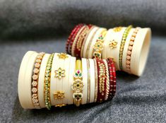 Heavy rajputi chura. Dhal Uttar chura. Indian wedding bridal rajputi chura in ivory colour with beautiful kundan work. Royal rajputi look. This is a beautiful handmade bangle set with Rajputi, Marwari and Rajasthani cultural look made in pure boor material and other material bangles also included. We are based in Jodhpur Rajasthan which is a city of rich heritage culture and the same touch we provide in our designs. we provide premium quality handmade designer bangles with rich stone and kundan work perfect for all traditional outfits and also for gifting purpose. This is a royal bridal chura with rich kundan work on boor base. A premium product. Royal Rajputi Look, Rajputi Look, Jodhpur Rajasthan, Designer Bangles, Rajputi Jewellery, Bridal Chura, Kundan Work, Rose Mehndi Designs, Ivory Colour