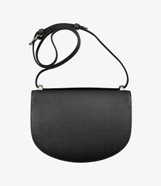 A.P.C. Women's bag.  - Bag in an upside-down Demi-Lune shape in embossed leather in striated motif.- Magnetic flap closure.- Adjustable leather shoulder strap.- Can be worn on the shoulder or across the chest.- Brass rings around the handle.- One large compartment.- One small interior pocket.- Reinforced rounded bottom.- Embossed goldtone 'A.P.C. Rue Madame Paris' logo. Foil Stamp, Stamp Logo, White Shirt Men, Paris Logo, White Shirts Women, Faux Leather Bag, Leather Label, C Logo, Backpack Tote Bag