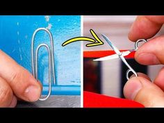 someone is cutting the paperclip with scissors