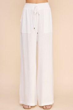 Stay comfortable and stylish in our Linen Wide Leg Pants! Made from soft linen, these pants feature a smock waist and wide leg design for a laid-back yet chic look. With convenient pockets, these pants are both practical and fashionable. Perfect for any casual occasion. Chic Summer Pull-on Style Pants, Summer Vacation Wide Leg Pants With Pull-on Style, Wide Leg Harem Pants With Pockets For Beach, Chic Harem Pants With Pockets For Vacation, Linen Wide-leg Bottoms With Side Pockets, Chic Cotton Wide Leg Pants With Pull-on Style, Wide Leg Harem Pants With Pockets For Vacation, Wide-leg Harem Pants With Side Pockets For Loungewear, Chic Summer Harem Pants With Pockets