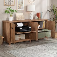 a living room scene with focus on the printer and cabinet in the foreground as well as an area rug