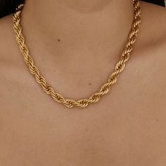 This Rope Chain Necklace in 18k gold plating epitomizes classic elegance. Its durable and intricately woven design is perfect for everyday wear or as a sophisticated accent to more formal attire. Luxe Necklace, Chunky Choker, 18k Gold Necklace, Stacked Necklaces, Going Solo, Gold Rope Chains, Rope Chain Necklace, Choker Style, Rope Necklace