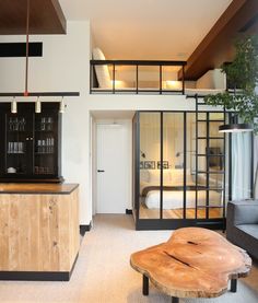 a living room filled with furniture and a wooden table