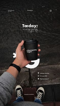 a person holding a coffee cup with the words teaday on it and an arrow pointing up