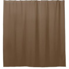 a tan shower curtain hanging on a white wall