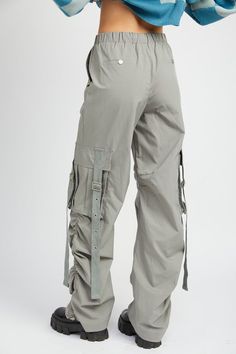 Grab these Emory Park Cargo Parachute Pants and let the breeze kick up your fashion game! With plenty of pockets for storage, these cargo pants will have you ready for take-off, in style! So "hop" to it and order them today! (Note: actual take-off not guaranteed). SIZE & FIT :MODEL WEARS SIZE SMALLMODEL'S HEIGHT 5'9 Made In: IMPORTED Fabric Contents: 100% POLYESTER Stretch fabric Non-sheer fabric Size Measurement (inch): S: (Waist), (Hips), (Inseam), (Length) M: (Waist), (Hips), (Inseam), (Lengt Spring Combat Cargo Pants, Spring Combat Pants With Pockets, Spring Techwear Bottoms With Cargo Pockets, Spring Techwear Pants With Cargo Pockets, Spring Techwear Cargo Pants With Multiple Pockets, Spring Techwear Cargo Pants With Belt Loops, Spring Techwear Cargo Jeans, Utility Cargo Parachute Pants, Spring Utility Cargo Pants With Functional Pockets