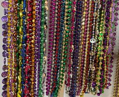 "Beads, beads, beads! Who needs Mardi Gras beads? I have all sorts of colors, shapes, and sizes in cool 90s and millennium vintage designs. Colors include purple, green, gold, black, silver, red, blue, orange, and pink. Bead shapes traditional round beads, sparkle beads, peace signs, disco balls, twists, hearts, Fleur De Lis, masks, musical instruments, footballs, and more. You can specify preferences for shapes, styles, and colors. Bead lengths vary, basically from 16\" long to 2 feet. The bead diameter sizes also vary from the standard size of 1/8 of an inch to approximately 1/2 of an inch in diameter.  You get to choose the number, style, and color of the beads you want while supplies last.  Packages are small (4 beads), medium (7 beads), and large (10 beads). Mix and match colors and d Multicolor Oval Beads Necklace For Festive Occasions, Multicolor Beads For Party And Festivals, Vintage Multicolor Beaded Bracelets For Party, Multicolor Large Beads For Celebrations, Colorful Beaded Necklaces For Party And Festivals, Party Beaded Necklaces For Festivals, Party Beaded Necklaces With Round Beads For Festivals, Colorful Beads Necklace For Party And Festivals, Colorful Beaded Necklace For Party And Festivals