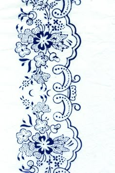 a blue and white lace border with flowers