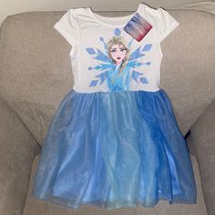 Condition: Nwt Size: Little Girl, 6 Color: White Top With Elsa Graphic. Blue Tulle Skirt With Lining Blue Short Sleeve Princess Dress For Dress-up, Blue Princess Dress With Short Sleeves For Dress-up, Disney Short Sleeve Dresses With Character Print, Cute Blue Princess Dress With Short Sleeves, Blue Short Sleeve Cute Princess Dress, Spring Disney Short Sleeve Dresses, Disney Style Short Sleeve Spring Dresses, White Princess Tutu Dress With Short Sleeves, Short Sleeve Cotton Dresses With Character Print