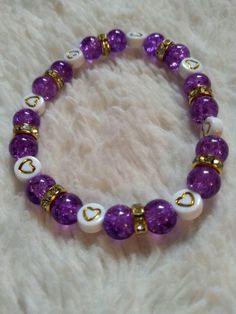 A sibling of the plastic crackle bracelets also sold here, this design features beautiful deep purple crackle beads.  This time, they're made of glass. The rich color shines bright and beautiful in any light! More colors soon to come! Purple Stretch Bracelet With Colorful Beads, Colorful Beaded Purple Bracelets, Purple Colorful Beaded Bracelets, Purple Glass Bracelets For Gifts, Purple Czech Glass Bracelets With Colorful Beads, Purple Glass Beaded Bracelets For Gift, Purple Glass Beaded Bracelets As Gift, Purple Glass Bracelets As Gift, Purple Czech Glass Bracelet With Colorful Beads