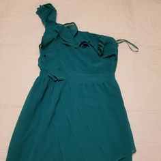 Knee Length One Shoulder Teal Dress. Purchased For A Wedding As A Bridesmaid Dress. Never Been Worn. Zipper Sticks A Little Formal One-shoulder Flowy Dress, Flowy One-shoulder Formal Dress, Flowy Sleeveless Mini Dress For Bridesmaids, Green Ruffled Mini Dress For Wedding, Green Ruffled Dress For Bridesmaid, Blue Chiffon Mini Dress For Cocktail Occasions, Blue Chiffon Mini Dress For Cocktail Events, Blue Chiffon Mini Dress For Cocktail, Blue Chiffon Cocktail Mini Dress