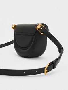 Add elegance and finesse to your everyday style with the latest addition to the cult favourite Koa range, the Koa moon saddle bag in classic black. Featuring an effortlessly chic curved silhouette that adds structure to any outfit, this bag is perfect for days at the office, dinner dates, and everything in between. Fitted with a distinctive square push-lock closure that opens up into two separate compartments, this piece will help you keep your belongings organised and easy to reach. Dinner Dates, Brand Collaboration, Size Chart For Kids, Charts For Kids, The Cult, Charles Keith, Saddle Bag, Printables Kids, Belt Size