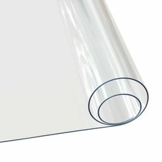 a roll of clear plastic sheeting sitting on top of a white surface with a black outline