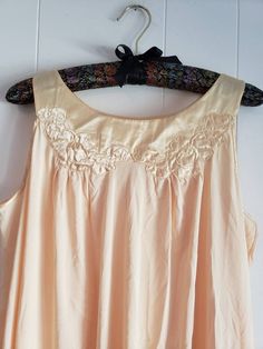 This is a vintage Gossard Artemis nightgown. This piece is sleeveless and is a very pretty shade of pale yellow. There are floral appliques and a satin hem and trim. This piece is labeled a size small, but I think it can fit a larger size than that. There is a small speck and a minor tug in this nightgown. You can see this in the images. The price reflects this. The measurements are as follow: (All measurements taken flat.) Please compare the measurements to your own well fitting clothes as I do Beige Sleeveless Sleepwear For Wedding Night, Sleeveless Cream Nightgown For Wedding, Vintage Sleeveless Nightgown For Spring, Vintage Sleeveless Spring Sleepwear, Vintage Sleeveless Sleepwear For Spring, Sleeveless Nightgown For Wedding In Spring, Spring Sleeveless Wedding Nightgown, Sleeveless Spring Wedding Nightgown, Cream Sleeveless Sleepwear For Wedding Night