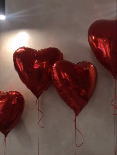 red heart shaped balloons hanging on the wall