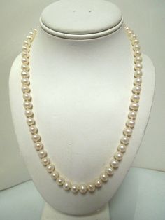 For Sale: (1) s819 Genuine Pearl Necklace with 14kt Yellow Gold Clasp 20"   PLEASE READ ENTIRE DESCRIPTION BEFORE PURCHASING   Pre-owned vintage item. Good condition. Please see pictures for details. Sold as is, as seen on pictures,  Pearl necklace with 14kt gold clasp 20in. Total Weight : 38.3g Pearls are approx. 7mm Beautiful single strand genuine  pearl in amazing condition without obvious blemishes or defects.  Magnificent ivory color and perfect sheen with 14kt clasp. Please review all pictures carefully.   ------------------------------------------------------------------------------------------------------------------------------------------------ Please be 100% sure of your purchase before buying, as we do not offer refunds. We are more than happy to provide any specific pictures, Elegant Yellow Gold-plated Pearl Necklace, Classic Yellow Gold-plated Pearl Necklace, Gold-plated Yellow Gold Pearl Necklace With Pearl Charm, Adjustable 14k Gold-filled Pearl Necklace Gift, 14k Yellow Gold-filled Pearl Necklace With Adjustable Chain, Genuine Pearl Necklace, Ivory Color, Fine Jewellery Necklace, 14kt Gold