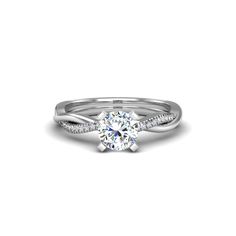 a white gold engagement ring with a twisted band and a round diamond in the center