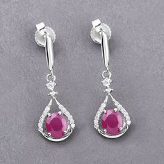 Ruby Earrings, Ruby Gold Earrings, Ruby Dangle Earrings, White Gold Earrings, July Birthstone, Bridesmaid Earrings, Minimalist Earrings  Stand out from the crowd with these glittering dangle earrings! Their unique shape and can't-be-missed coloring are the perfect way to make your outfit pop! Made of genuine oval ruby gemstones, these have a total weight of 0.70 carats. The earrings are made of fine finish 14k white gold. Product Details:  14K White Gold Stone Details: Ruby Item Type: Earrings G White Gold Gemstone Drop Earrings, White Gold Drop Bridal Earrings, Ruby Gold Earrings, Earrings Stand, Earrings White Gold, Earring Stand, Aquamarine Jewelry, Silver Gemstone Jewelry, Ruby Earrings