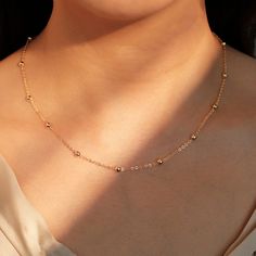 "Introducing our Gold Shiny Ball Chain Necklace, the perfect personalized gift for her. Crafted with care and plated in gold, this necklace features a shiny ball chain design that exudes elegance. Add her initial to make it truly unique and meaningful. Surprise her with our Gold Shiny Ball Chain Necklace, a beautiful and thoughtful gift she'll cherish forever. Personalized Y Necklace https://www.etsy.com/listing/1523378005/personalized-y-necklace-16k-gold-plated double chain simple initial neckl Double Layer Gold Chain Design, Trendy Ball Chain Necklace As Gift, Trendy Ball Chain Necklace For Gift, Trendy Gold Ball Chain Necklace, Gold-plated Ball Chain Necklace, Perfect As A Gift, Gold Plated Ball Chain Necklace Gift, Trendy Gold Necklace With Round Beads, Dainty Charm Necklaces With Ball Chain For Gift, Dainty Ball Chain Charm Necklaces As Gift