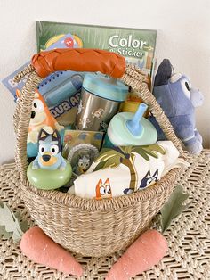 a basket filled with baby items on top of a table