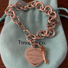 Authentic Tiffany & Co Silver Heart Tag Charm Bracelet With Rubedo Mini Key. Designed For Tiffany & Co’s 175th Birthday. Good Condition, A Few Minor Scratches From The Key Swinging On The Heart Tag. Luxury Heart Bracelet For Valentine's Day Formal, Jewelry Tiffany, Heart Tag, Tiffany Co Jewelry, Tiffany And Co, Silver Heart, Tiffany & Co., Womens Jewelry Bracelets, Fashion Inspiration