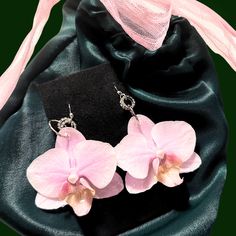 preserved orchid earrings made from real flowers Orchid Earrings Flower, Handmade Orchid Earrings, Elegant Orchid Flower Jewelry, Elegant Pink Pressed Flowers Jewelry, Elegant Pink Jewelry With Pressed Flowers, Pink Birth Flower Earrings For Wedding, Elegant Orchid Flower Earrings, Orchid Flower-shaped Earrings For Gift, Aros Aesthetic