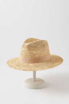 For a fresh summer look, head out with the Charlie safari hat as your finishing touch. Whether you're wearing a sundress or a linen shirt, you'll be ready for sun, sand, and socializing in this dapper design. Crafted from crocheted raffia, this lightweight hat features a grosgrain hatband with bow and an adjustable sweatband for all-day comfort. Spring Woven Toquilla Straw Fedora, Casual Toquilla Straw Panama Hat For Spring, Casual Spring Fedora In Toquilla Straw, Casual Toquilla Straw Fedora For Spring, Spring Wide Brim Fedora, Woven Panama Hat For Day Out, Summer Travel Sun Hat Made Of Toquilla Straw, Casual Fedora Panama Hat For Warm Weather, Casual Fedora For Vacation And Kentucky Derby