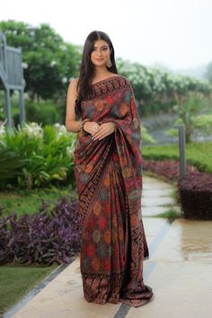 Black Kani saree is crafted in silk fabric and is accentuated all over with Kani Jamawar weaving  in traditional motifs like paisleys and flowers in gorgeous colours. A touch of zari is woven into the threads to add a hint of shine and to the royalty of this gorgeous saree. It comes with a blouse piece in same colour that has Kani weaving in booti pattern.  The design inspiration for this Pashmina Silk saree is drawn from the heritage weaves of ancient Pashmina shawls from Kashmir that date back Luxury Tussar Silk Shawl In Bollywood Style, Luxury Pashmina Traditional Wear For Ceremonies, Chanderi Meenakari Pre-draped Saree For Navratri, Multicolor Pre-draped Saree For Eid, Elegant Jamawar Pre-draped Saree For Eid, Bollywood Style Jamawar Pre-draped Saree For Diwali, Multicolor Tussar Silk Pre-draped Saree For Eid, Navratri Katan Silk Pre-draped Saree With Meenakari, Navratri Meenakari Tussar Silk Pre-draped Saree