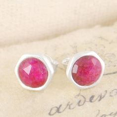 Ruby Birthstone Sterling Silver Stud Earrings - Beautiful and divine, these handmade round stud earrings feature a rose-cut precious Ruby stone set into gently textured sterling silver. #Embersjewellery #Jewellery #Valentine #Valentinesday #PersonalisedGift #ForHer Sterling Silver Stud Earrings, Ruby Stone, Round Stud Earrings, July Birthstone, Ruby Gemstone, Silver Stud Earrings, Sterling Silver Studs