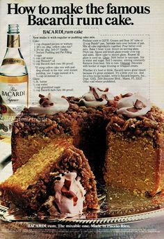 an advertisement for bacardi rum cake with a slice taken out of it and a bottle in the background