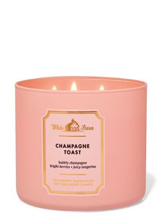 a pink candle that is sitting in front of a white background with the words champagne toast on