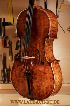 an old violin sitting on top of a table