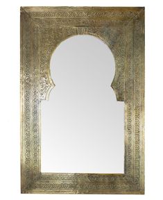 an ornate gold framed mirror on a white background with a shadow in the middle,