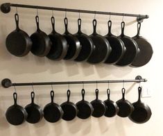 pots and pans are hanging on the wall