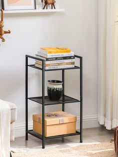 a shelf with books and other items on it in the corner of a living room