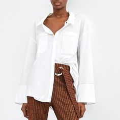 Nwt Zara Size Xs White Contrasting Topstitching Shirt Brand New With Tags - 100% Cotton Oversized Fit Trendy White Blouse With Pockets, White Office Top With Shirttail Hem, White Office Tops With Pockets, White Office Top With Pockets, Zara Blouse With Pockets For Workwear, Chic Zara Blouse With Pockets, Zara Workwear Blouse With Pockets, White Blouse With Shirttail Hem For Fall, Chic White Shirt With Pockets