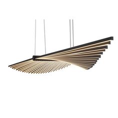 a suspended light fixture with wooden strips hanging from the ceiling