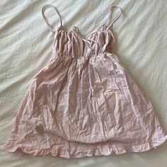 Super Cute Light Pink Revolve Mini Dress. Fabric Similar To Linen? Never Worn, Tags Still On -Adjustable Straps -Replacement Button (Too Short For 5’11”+) Cute Sleeveless Mini Dress With Tie Back, Summer Ruffle Dress For Sleepover, Summer Ruffled Dress For Sleepover, Cute Pink Mini Dress With Tie Back, Sleeveless Ruffled Dress For Sleepover, Spring Tie Back Casual Dress, Spring Casual Tie-back Dress, Loungewear Dresses With Spaghetti Straps And Ruffles, Spaghetti Straps Ruffled Dresses For Loungewear