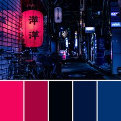 an alleyway at night with chinese lanterns lit up in red and blue, along with other street lights